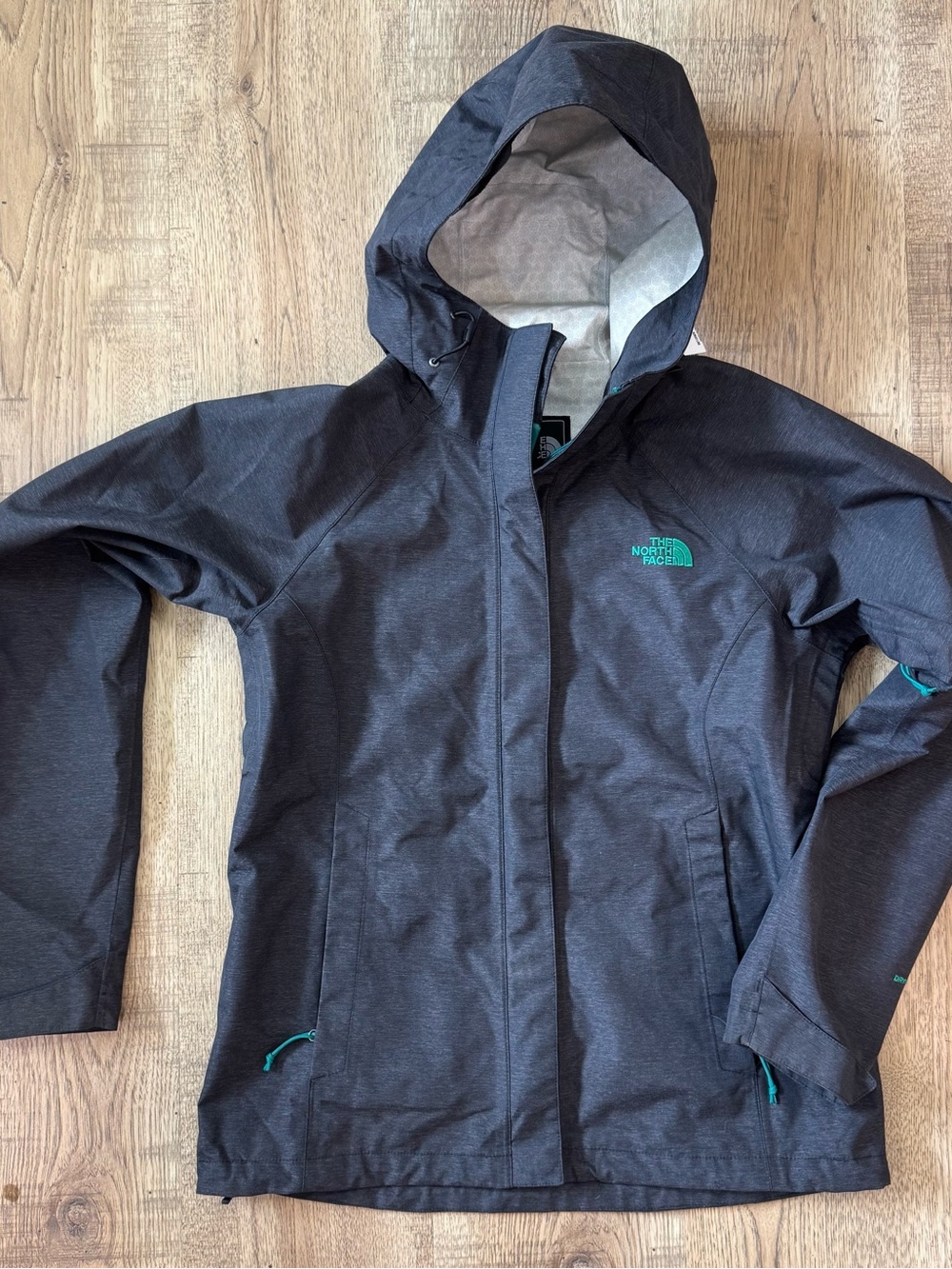 The North Face Women's Jacket in Charcoal Gray with Teal Accents